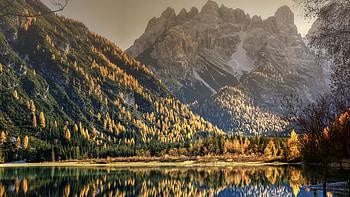 Landscape View Of Rock Mountain With Snow Slope Colorful Autumn Trees Reflection On River Mountain HD wallpaper