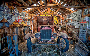 Old vehicle in a garage filled with signs from around the Eastern Sierra, Bishop, CA, shed, tyres, vintage, car HD wallpaper