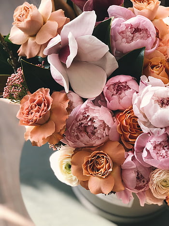 A stunning arrangement of mixed spring flowers in a vibrant, romantic bouquet, perfect for celebrations. HD phone wallpaper