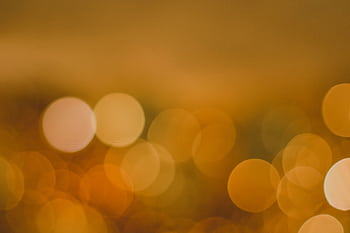 Abstract golden bokeh background with glowing circles, perfect for festive designs. HD wallpaper