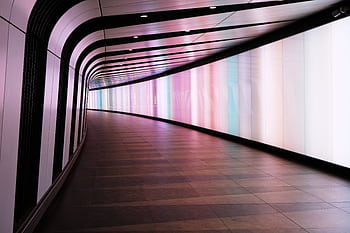 A mesmerizing futuristic tunnel with colorful lights and modern design in London. HD wallpaper