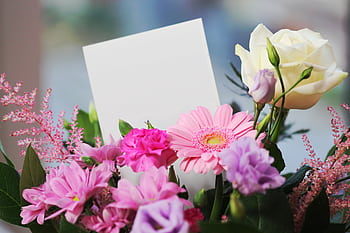 A colorful bouquet of flowers with a blank card, perfect for any occasion. HD wallpaper