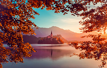 Autumn lake Bled, island, fall, beautiful, tree, mountain, lake, leaves, Bled, reflection, branches, autumn, water, Slovenia, foliage HD wallpaper