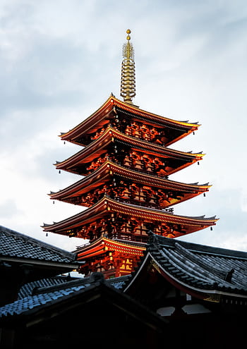 Stunning view of a traditional five-storied pagoda at sunset in Tokyo, Japan. HD phone wallpaper