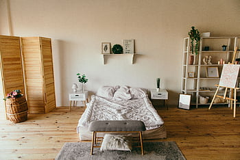 Elegant modern bedroom featuring wooden elements, soft lighting, and minimalist design. Perfect for interior inspiration. HD wallpaper