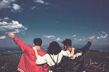 A joyful moment with friends overlooking a scenic landscape in Gia Lai, Vietnam. HD wallpaper