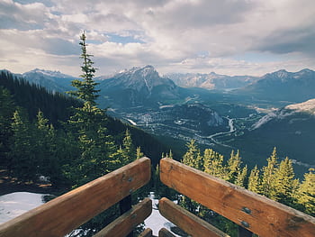 Breathtaking view of Banff National Park with mountains and evergreen trees. HD wallpaper