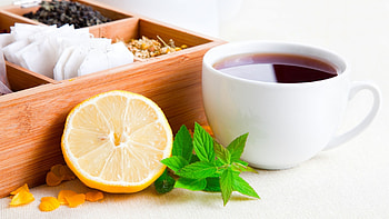 Tea cup with leaves , quality, Refreshing , Natural elements HD wallpaper