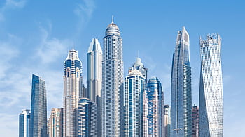 Stunning view of Dubai's iconic skyscrapers under a clear blue sky. HD wallpaper