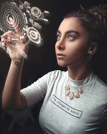 Woman in a modern setting interacting with a holographic user interface. Futuristic concept. HD phone wallpaper