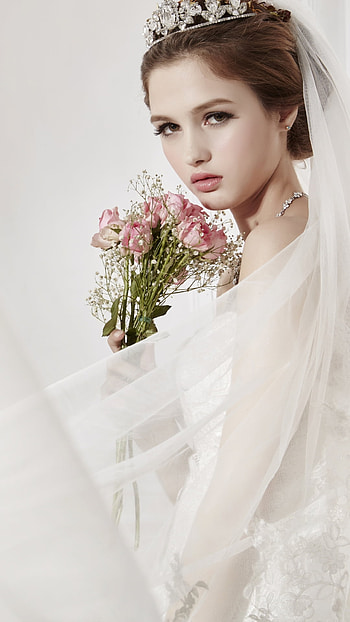 Veiled Elegance: Brown-Eyed Bride with Bridal Blooms, wedding dress, brown eyes, flower, woman, bride HD phone wallpaper