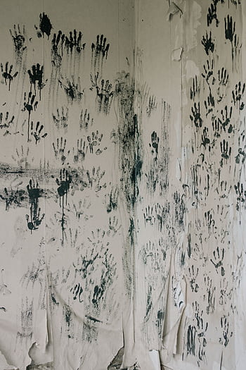 Mystical handprints cover a peeling wall, creating an unsettling and ghostly atmosphere. HD phone wallpaper