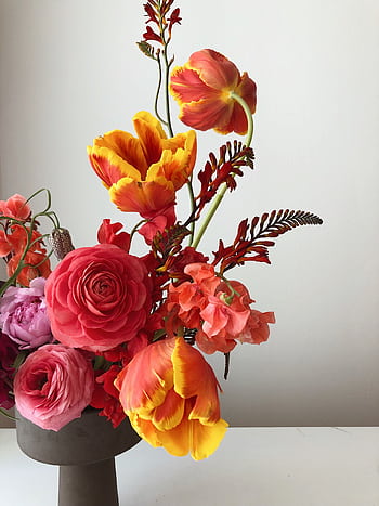 Vibrant floral bouquet featuring tulips, roses, and snapdragons in a vase. HD phone wallpaper