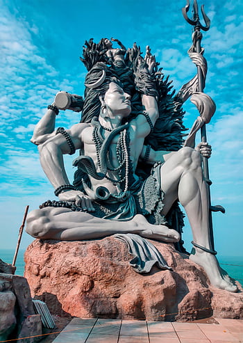 A stunning statue of Lord Shiva in Kazhivoor, India, showcasing divine artistry and spirituality. HD phone wallpaper