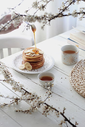 Enjoy a homemade breakfast with banana pancakes and tea, perfect for a fresh spring morning. HD phone wallpaper