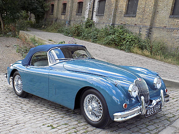 Jaguar XK150, building, british, jaguar, car HD wallpaper