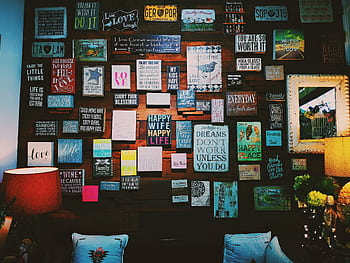 A warm and inviting indoor space with motivational quotes displayed on a wooden wall. HD wallpaper