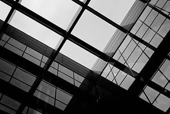 Black and white modern glass building showing low angle perspective in Paris. HD wallpaper