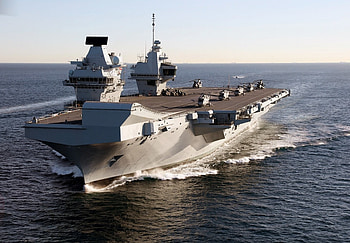 Carrier Strike Group 21 Flagship, sea, ski jump forward, merlin 4 on deck, on sea trials HD wallpaper