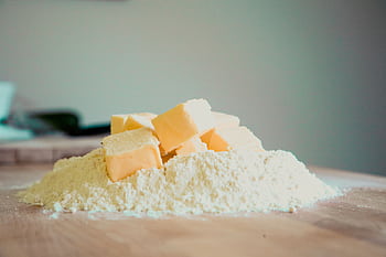 Close-up of butter and flour on a kitchen counter, perfect for baking. HD wallpaper