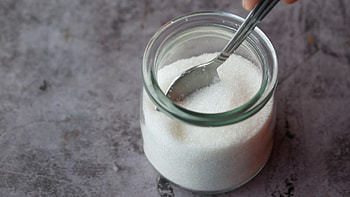 White sugar, Spoon in container, Black background, Stock video HD wallpaper