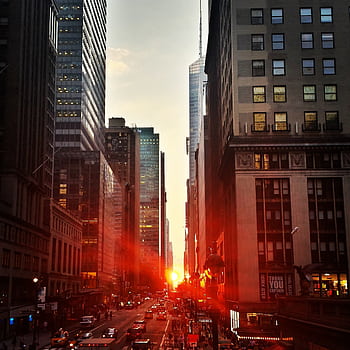 Captivating sunset view down a bustling street in Manhattan, New York City. HD phone wallpaper
