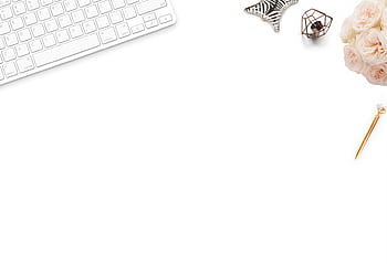 A top-down view of a white desk setup with floral decor, featuring a keyboard, pen, and flowers. HD wallpaper
