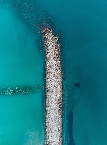 Rock pier, beach, drone view HD phone wallpaper