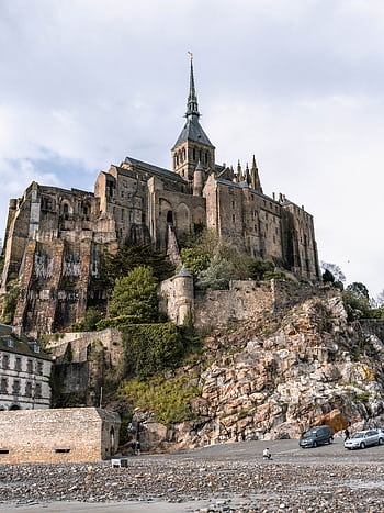 Explore the historic Mont Saint-Michel Abbey, a stunning landmark in Normandy, France. HD phone wallpaper
