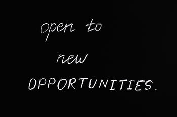 Blackboard with motivational quote 'Open to New Opportunities' in chalk writing. HD wallpaper