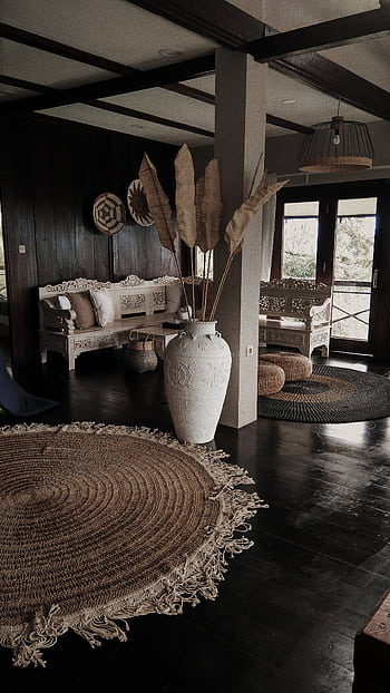 Cozy rustic living room with natural decor and vintage furniture, bathed in sunlight. HD phone wallpaper