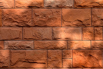Rustic red brick wall featuring natural stone texture and unique patterns. HD wallpaper