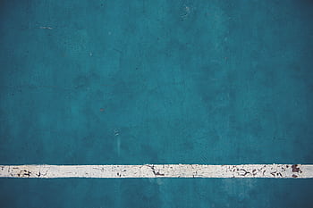 Close-up view of a textured blue wall with a weathered white line, perfect for abstract or background use. HD wallpaper