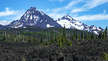 North and Middle Sisters standing above an ancient lava field, Oregon, sky, forest, peaks, clouds, trees, usa HD wallpaper