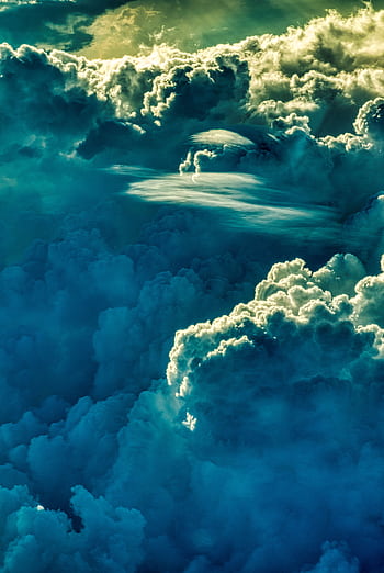 Breathtaking view of cumulus clouds lit by the sunrise, creating a dramatic skyscape. HD phone wallpaper