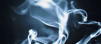 Artistic close-up of swirling white smoke against a dark background, creating a mystical effect. HD wallpaper