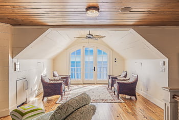 Bright and luxurious loft overlooking the ocean, featuring modern furniture and design. HD wallpaper