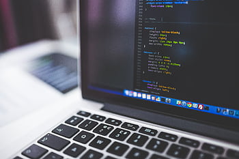 Laptop screen displaying code, perfect for tech-focused projects. HD wallpaper