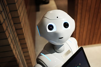 A futuristic humanoid robot in an indoor Tokyo setting, showcasing modern technology. HD wallpaper