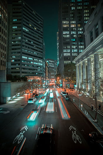 Long exposure of vibrant city traffic and skyscrapers in San Francisco at night. HD phone wallpaper