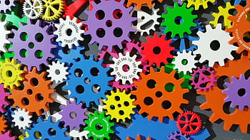 A colorful arrangement of gears symbolizing creativity, innovation, and machinery in vibrant colors. HD wallpaper