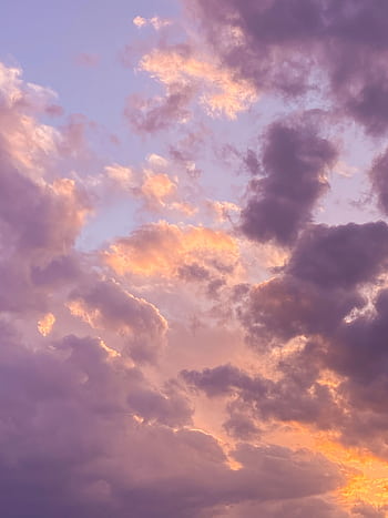 A peaceful evening sky with vibrant, colorful clouds during sunset, evoking tranquility. HD phone wallpaper