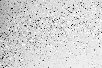 Macro shot of water droplets on a grey surface creating an abstract texture. HD wallpaper