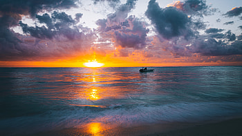 Boat On Ocean Beautiful Scenery Waves Under White Clouds Blue Sky During Sunset Reflection On Water Nature HD wallpaper