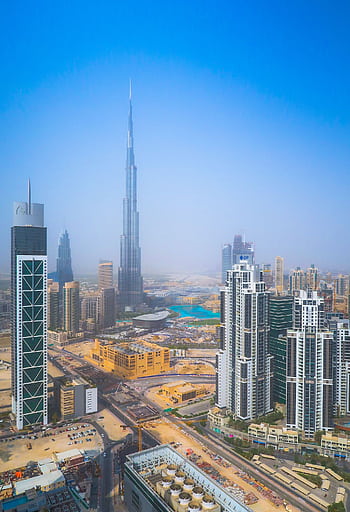 Stunning aerial view of Dubai's modern skyline with the iconic Burj Khalifa. HD phone wallpaper