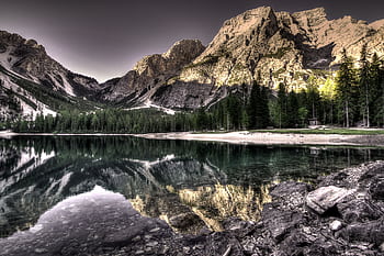 Stunning landscape of Dolomite mountains reflecting in a serene lake with lush greenery. HD wallpaper