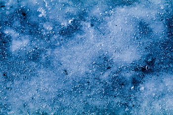 A close-up view of icy texture with bubbles, capturing the wintry feel of frozen surfaces. HD wallpaper