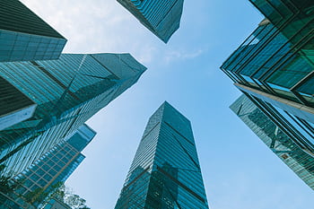 Low angle view of contemporary skyscrapers in Shenzhen, China under a clear blue sky. HD wallpaper