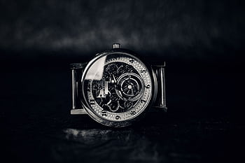 Close-up of a vintage mechanical wristwatch showcasing intricate gears and design. HD wallpaper