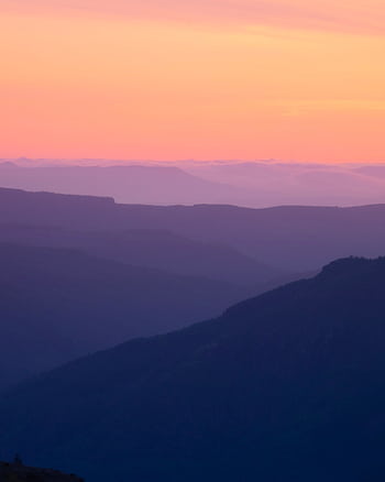 Beautiful layers of mountains under a vibrant sunrise sky in Washington State. HD phone wallpaper